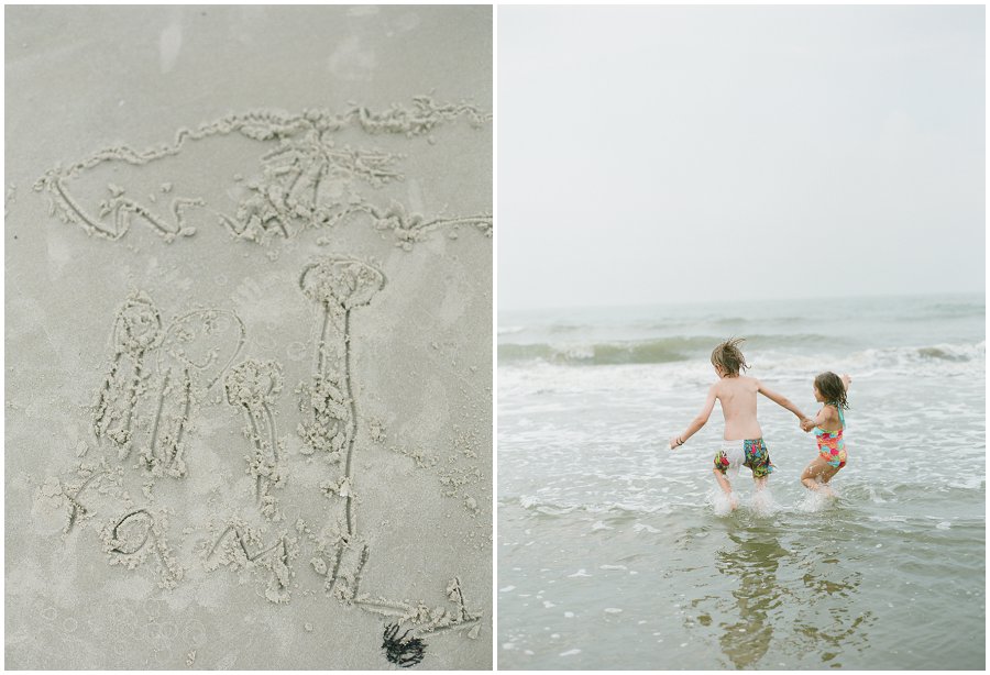 Family writing in the sand.