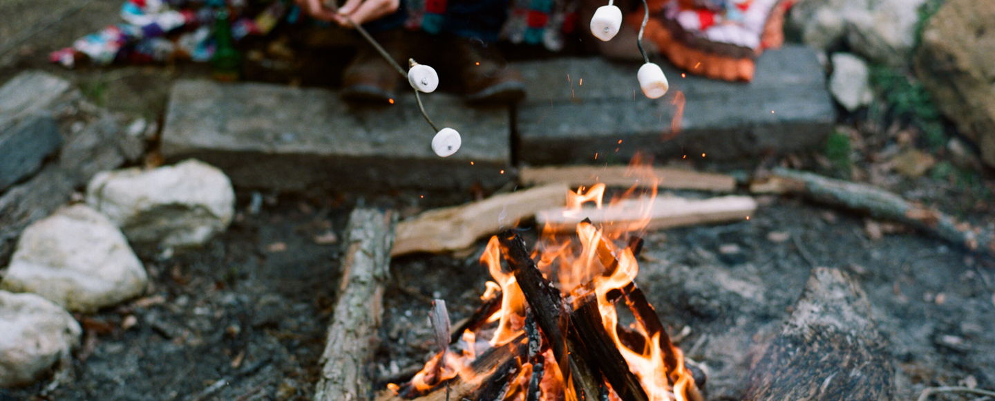 Dallas photographer Jenny McCann captures cabin themed engagement session on film.