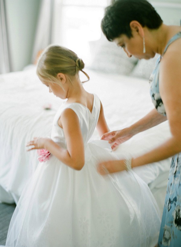 Flower girl getting ready at Dallas wedding.