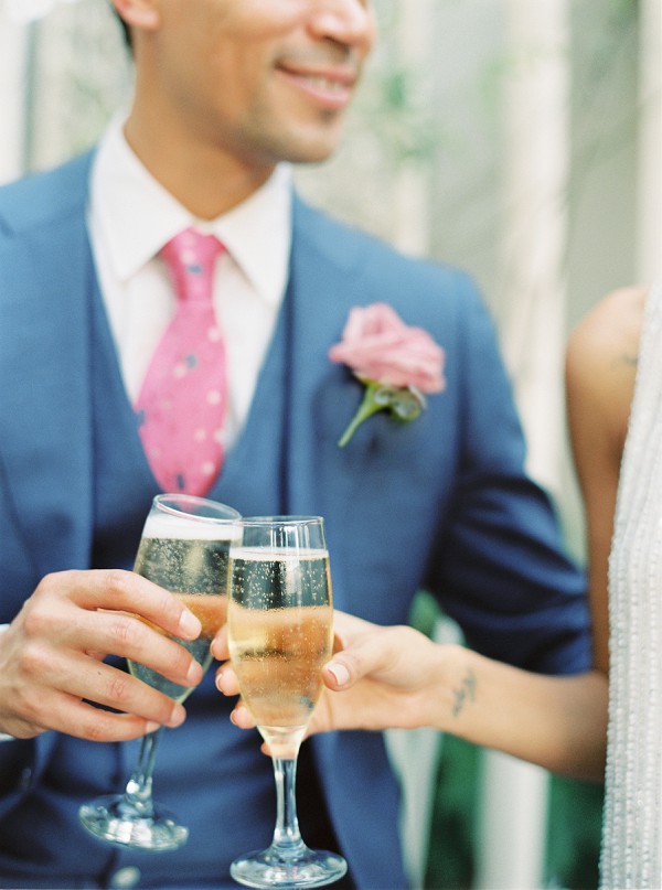 Dapper groom toasting by Dallas wedding photographer Jenny McCann.
